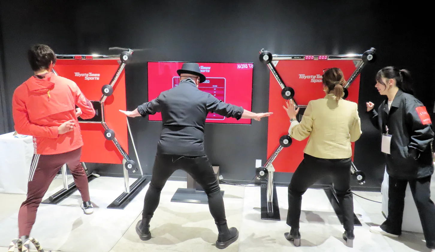 Guests competing on Toyota Times Sports reaction and coordination stations at a Toyota activation
