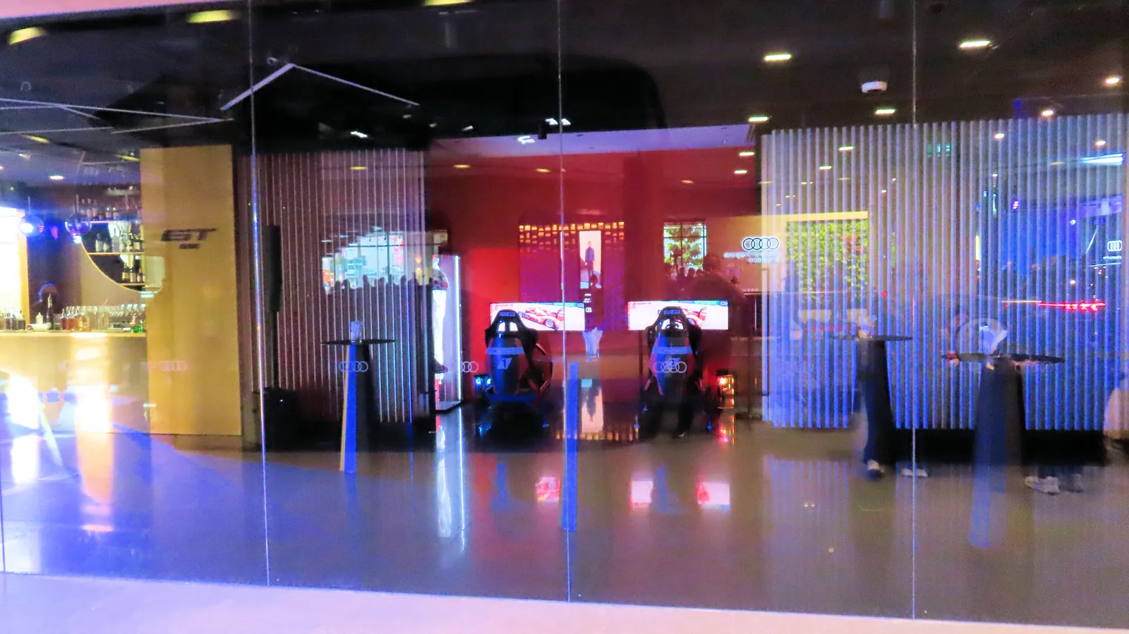 The Audi House of Progress esports racing space in Singapore, seen through an LED curtain wall